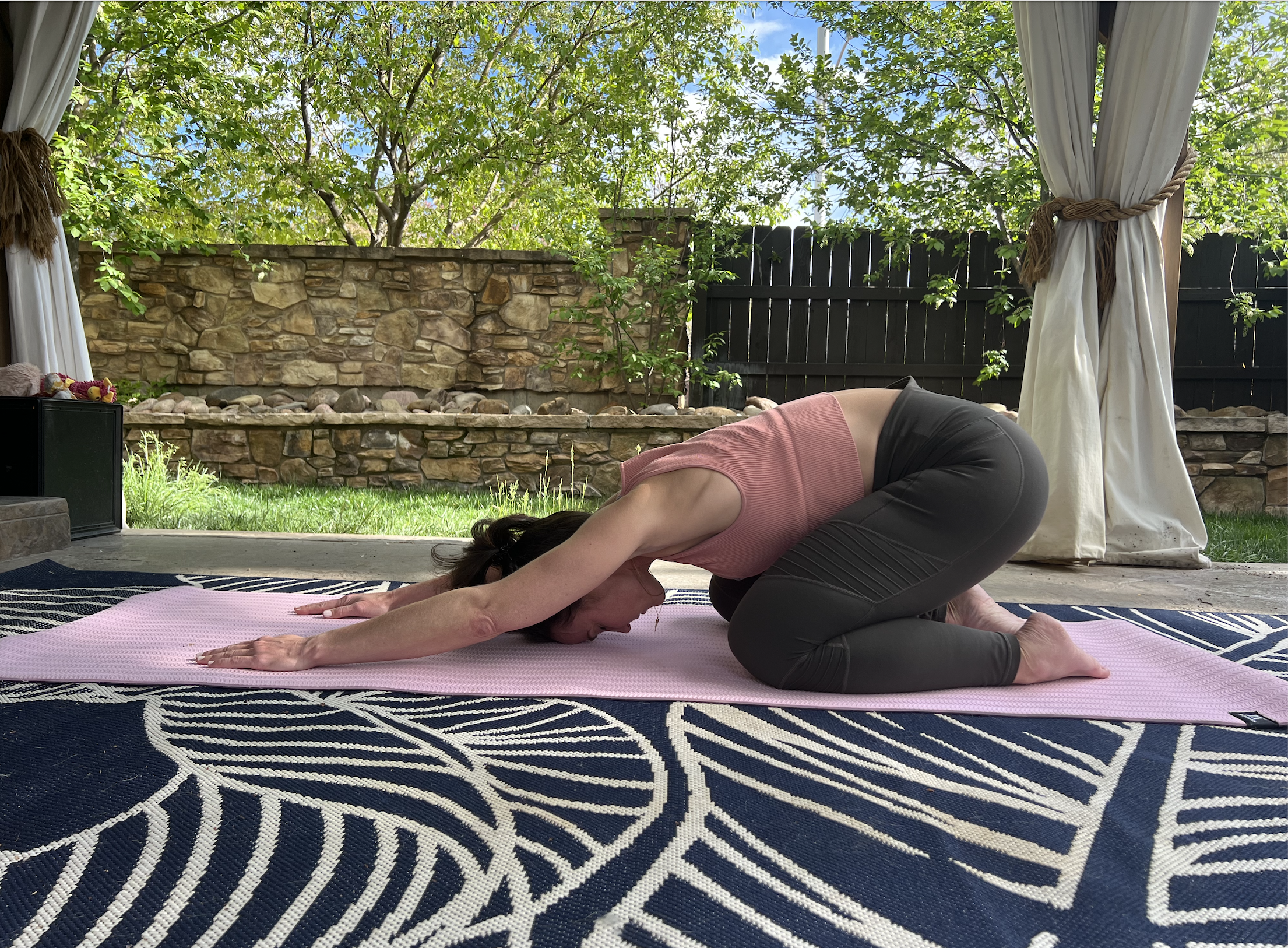 person doing childs pose